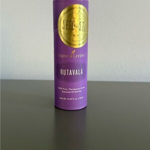 Young Living Rutavala Roll-On in Purple and Gold